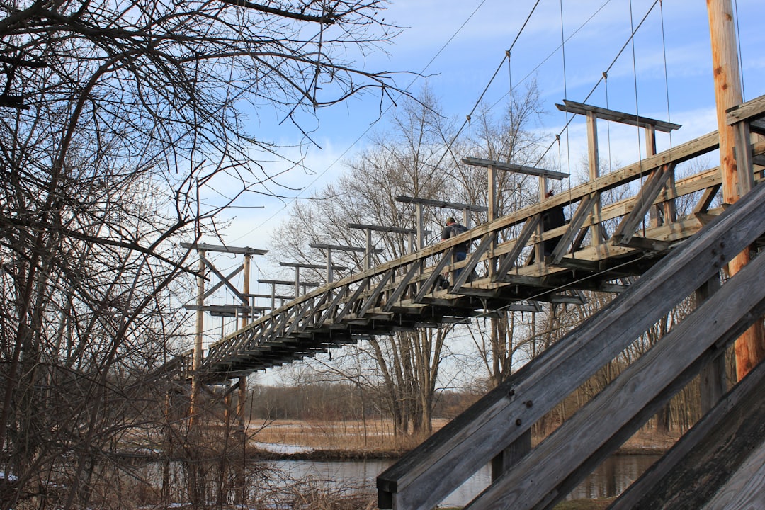Side-by-side comparison of current American electrical grid layout versus proposed resilient grid architecture with redundant pathways